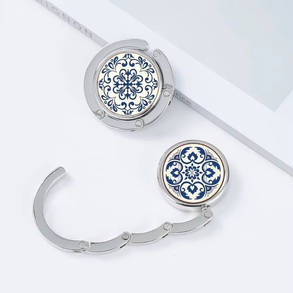 Blue floral pattern foldable bag holder on blue background